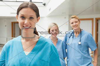 Smiling nurse with two friends