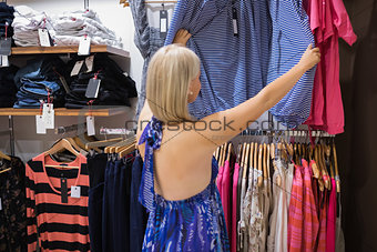 Woman looking through clothes