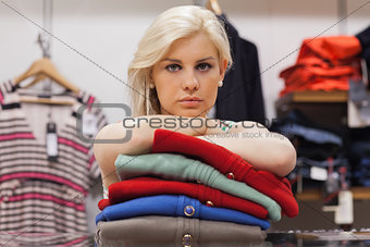 Woman leaning on clothes