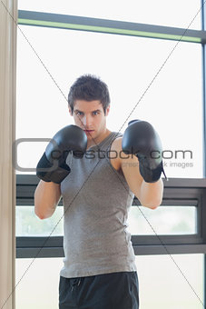 Man standing while boxing