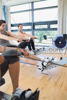 Woman looking up from rowing machine workout