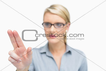 Businesswoman using two fingers to point