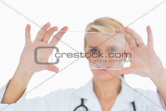 Doctor holding up clear pane