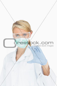 Surgeon looking through clear pane