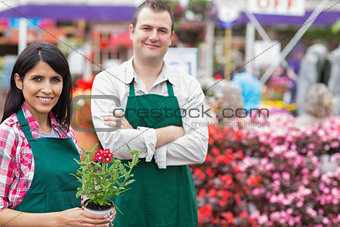 Two smiling garden center employees