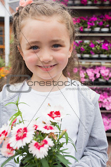 Child holding a flower