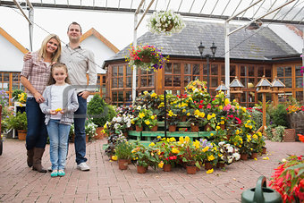 Family standing in the garden center