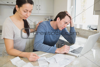 Young couple calculating finances