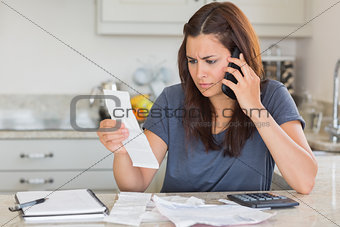 Woman calling while calculating