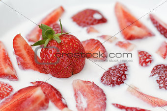 slices of strawberry in milk
