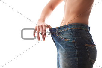 woman looking at loose fitting cloth on white background