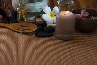 tropical spa setup with frangipani flower hot rocks and massage 