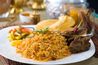 Biryani basmati mutton rice with traditional items on background