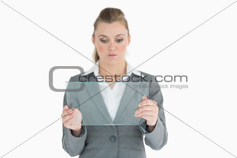 Businesswoman holding a glass slide