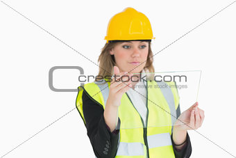Female architect holding a pane