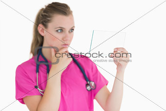 Female doctor looking at the pane