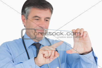 Doctor touching on clear pane