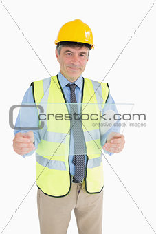 Architect smiling while holding a glass slide