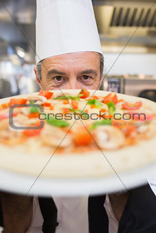 Man holding pizza