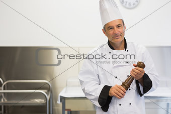 Chef holding a pepper mill