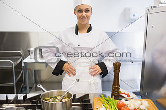 Chef standing at stove making soup