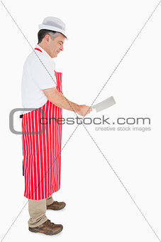 Butcher using meat cleaver