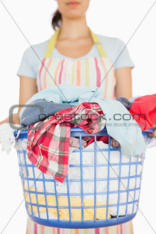 Woman holding basket of laundry
