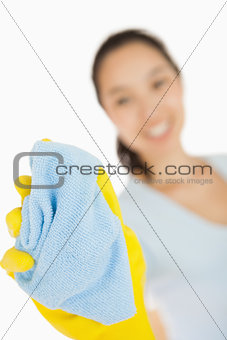 Happy woman cleaning window