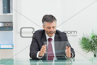 Business man holding a virtual screen