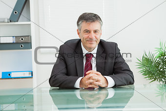 Man smiling in his office