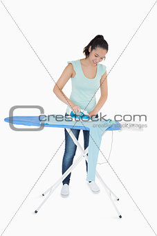 Woman ironing a jumper