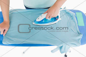Woman ironing a t shirt
