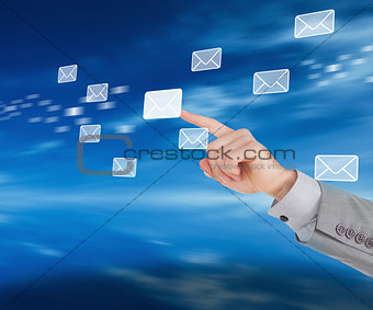 Businessman pointing at a message symbol