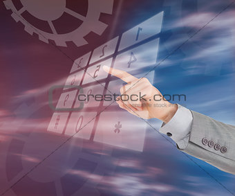 Businessman typing on holographic number pad