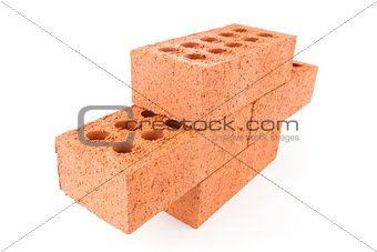 Four red bricks stacked as a part of a wall