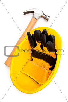 Two leather gloves in a helmet with a hammer