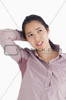 Embarrassed woman with sweat patches