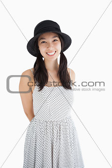 Cheerful woman with a polka dot dress and hat