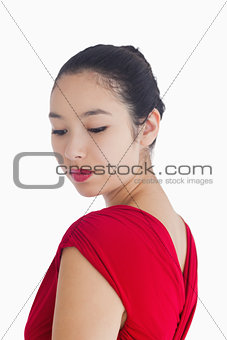 Woman in red dress smiling gently