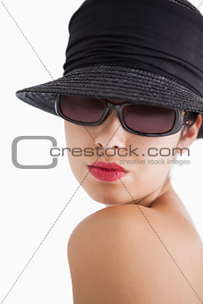 Woman wearing sunglasses and hat