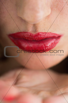 Close-up of air kiss with red lips