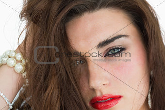 Woman with red lips wearing jewellery