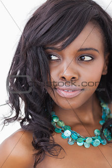 Woman smiling in blue necklace
