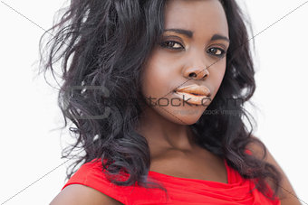 Woman with gold lips and red dress