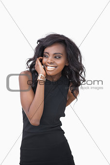 Woman with gold lips and black dress