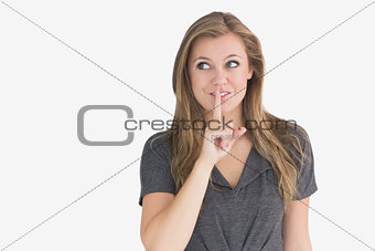 Woman making quiet sign