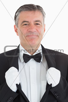 Waiter clinging at his jacket