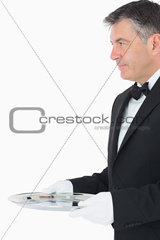 Waiter with a larger silver tray