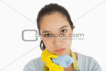 Weary woman holding cleaning rag