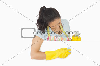 Woman wiping white surface
